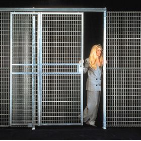 Wire mesh partition allows air circulation and light penetration.